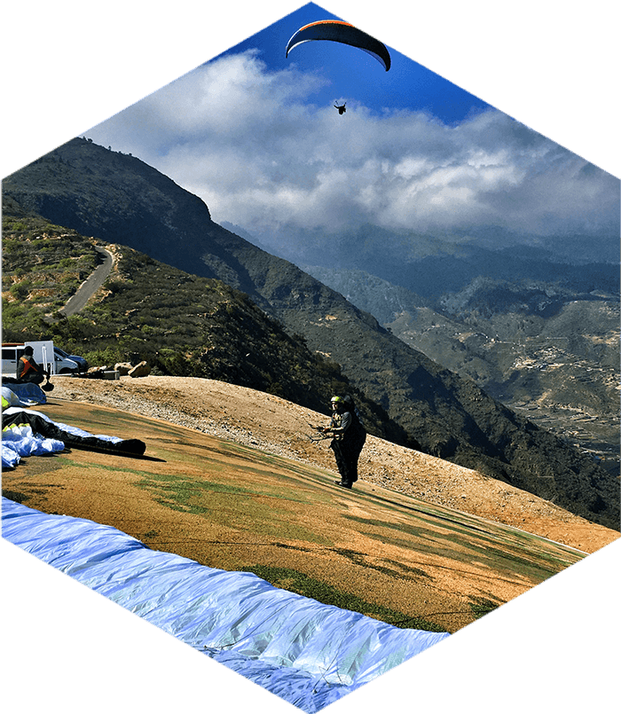 getting ready for paragliding take off on steep slope