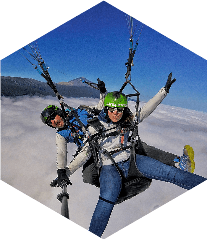 paragliding tandem flight above the clouds with Mount Teide in the background